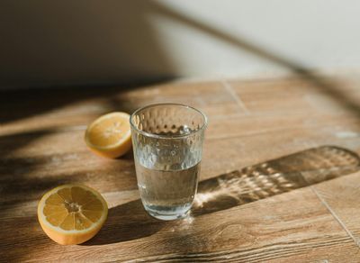 A glass of water with lemon, symbolizing hydration and a healthy lifestyle.