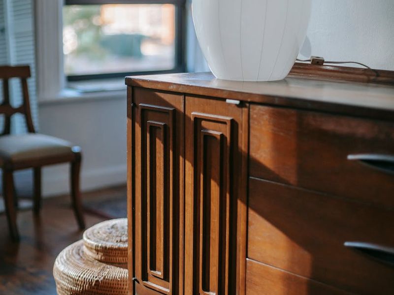 Person mid-stretch in a spacious, sunlit room, conveying a sense of freedom.